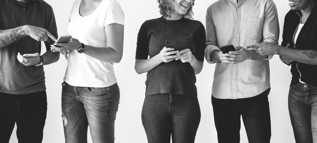 People Networking, Using Cell Phones In A Group